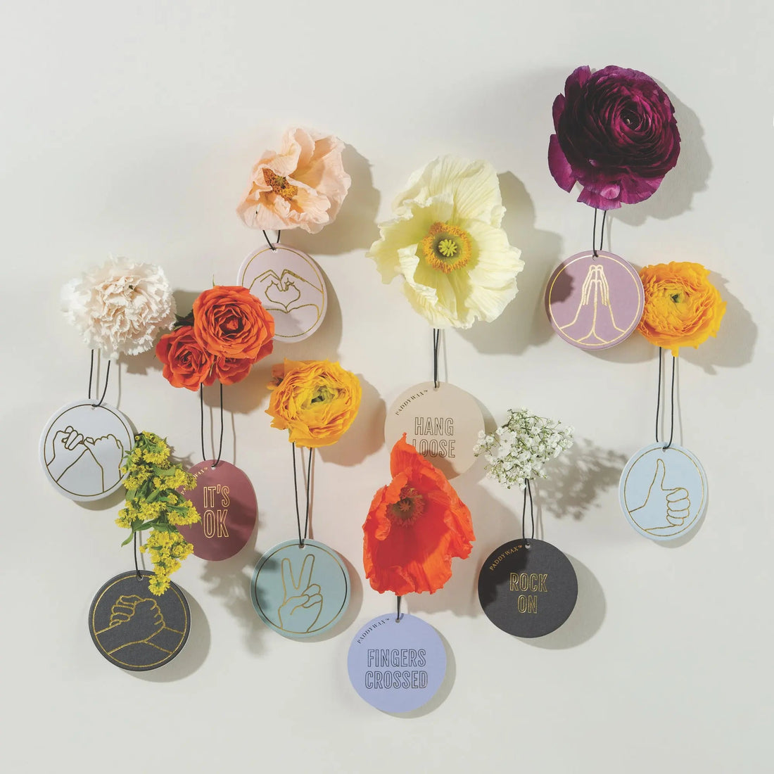 Impressions air fresheners hanging on light background
