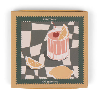 Paddywax’s Cocktail - Orange Matches jumbo matchbox features a checkered lid with a cocktail illustration, including a cherry, lemon slice, and wedges.