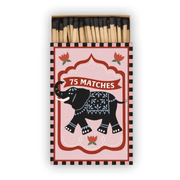 A Dopo "Elephant" - 75ct Boxed Matches feature a pink label with a black elephant, red flowers, white "75 MATCHES" text, and a black & white striped border that adds Mediterranean travel charm.