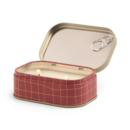 The Heirloom Tomato - Bistro 4.5 oz Tin Candle features a pink and gold rectangular tin with a sardine can-like partially opened lid, holding a white dual-wick candle that fills the air with a Parisian café-inspired fragrance.