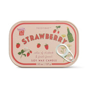 The Strawberry - Bistro 4.5 oz Tin Candle is a pink soy wax candle with illustrated strawberries, bottle, and glasses on the label. Scented with strawberry daiquiri notes of rhubarb and fennel, it features a pull-tab sardine can-style lid.