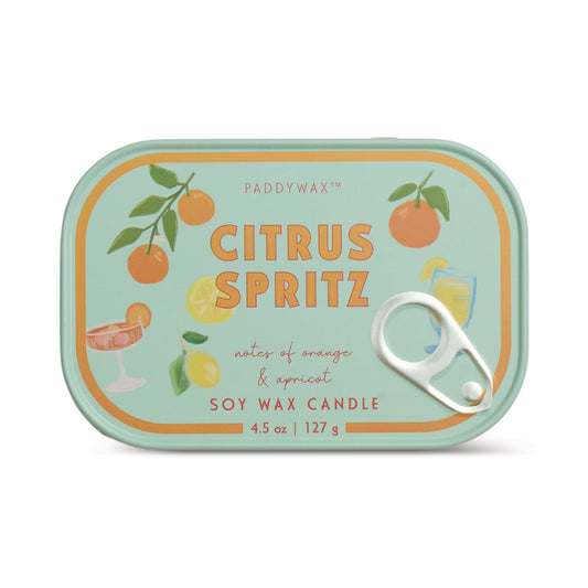 The Citrus Spritz - Bistro 4.5 oz Tin Candle comes in a rectangular sardine tin with a pull-tab lid, decorated with oranges, lemons, cocktails, and leaves, and features notes of orange and apricot on the label.