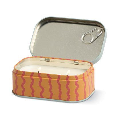 The Citrus Spritz - Bistro 4.5 oz Tin Candle features a rectangular sardine tin with a pull-tab lid, wavy red lines on an orange background, and opens to reveal a white, dual-wick Citrus Spritz candle inside.