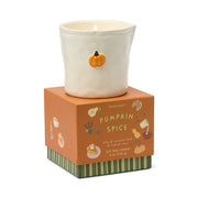 Pumpkin spice candle with decorative packaging on a white background