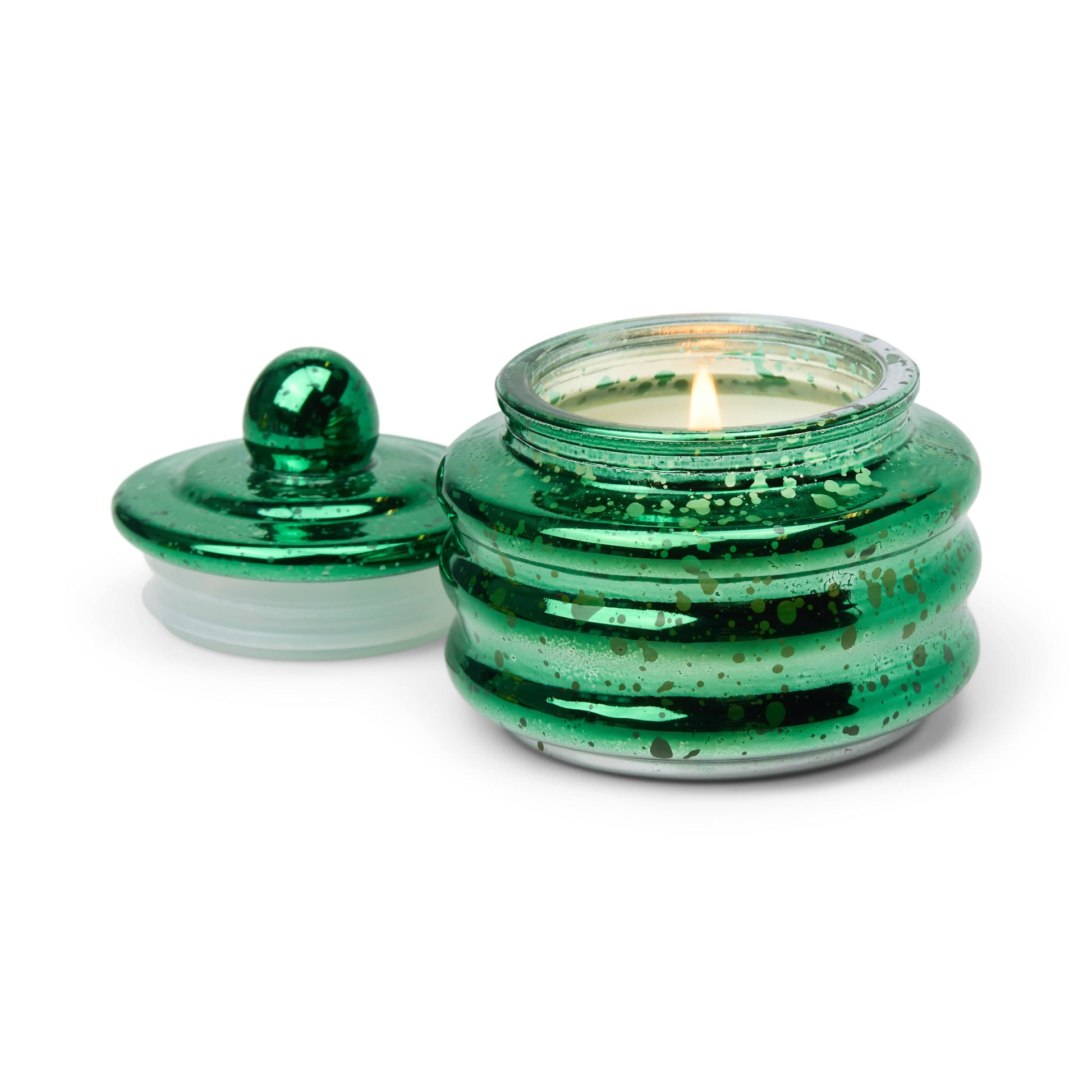 The Balsam & Fir - Beam 3 oz Candle sits in a shiny green speckled glass jar with a matching round lid—an ideal holiday gift or Christmas party favor.