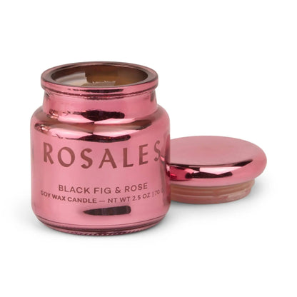A pink electroplated glass jar labeled Saffron Rose - Chroma Candle 2.5 oz, with the lid off and placed beside it, from the Chroma collection series.