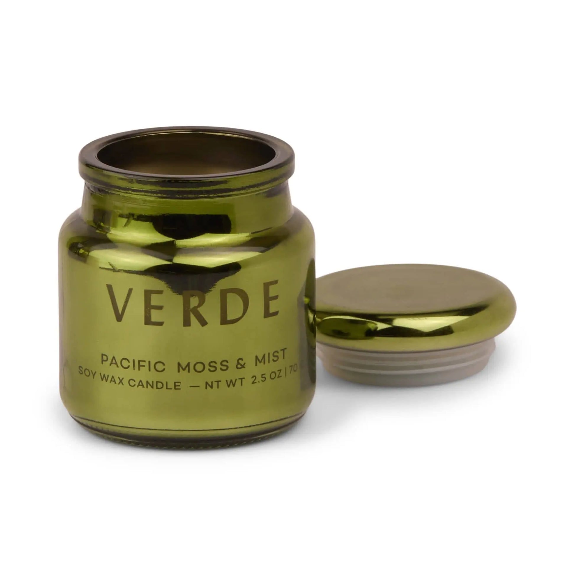 A green electroplated glass jar labeled Pacific Moss & Mist - Chroma Candle 2.5 oz, with its lid beside the open container—part of the Chroma candle collection inspired by Latin-inspired scents.
