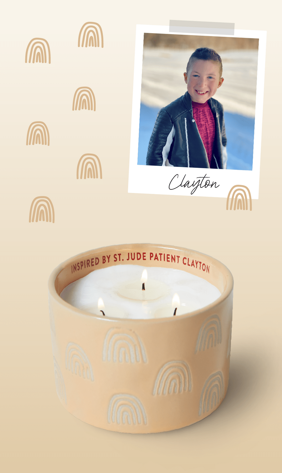 A beige candle with white rainbow designs and the words “Inspired by St. Jude patient Clayton” around the rim. Above is a photo of a smiling boy labeled “Clayton” on a light background with rainbow illustrations.