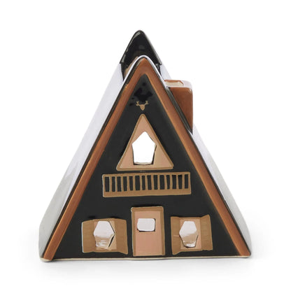 No. 01 The Nordic Cabin is a ceramic, A-frame house with black and brown accents, window and door cutouts, plus a deer head ornament—perfect as a cozy Scandinavian incense or tea light holder.