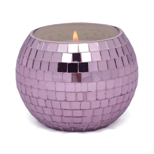 The Lavender Fern - Magique Disco Ball 10 oz candle features a round holder adorned with small, square, purple and silver mosaic tiles—ideal for disco candle lovers and anyone who enjoys sparkling décor.