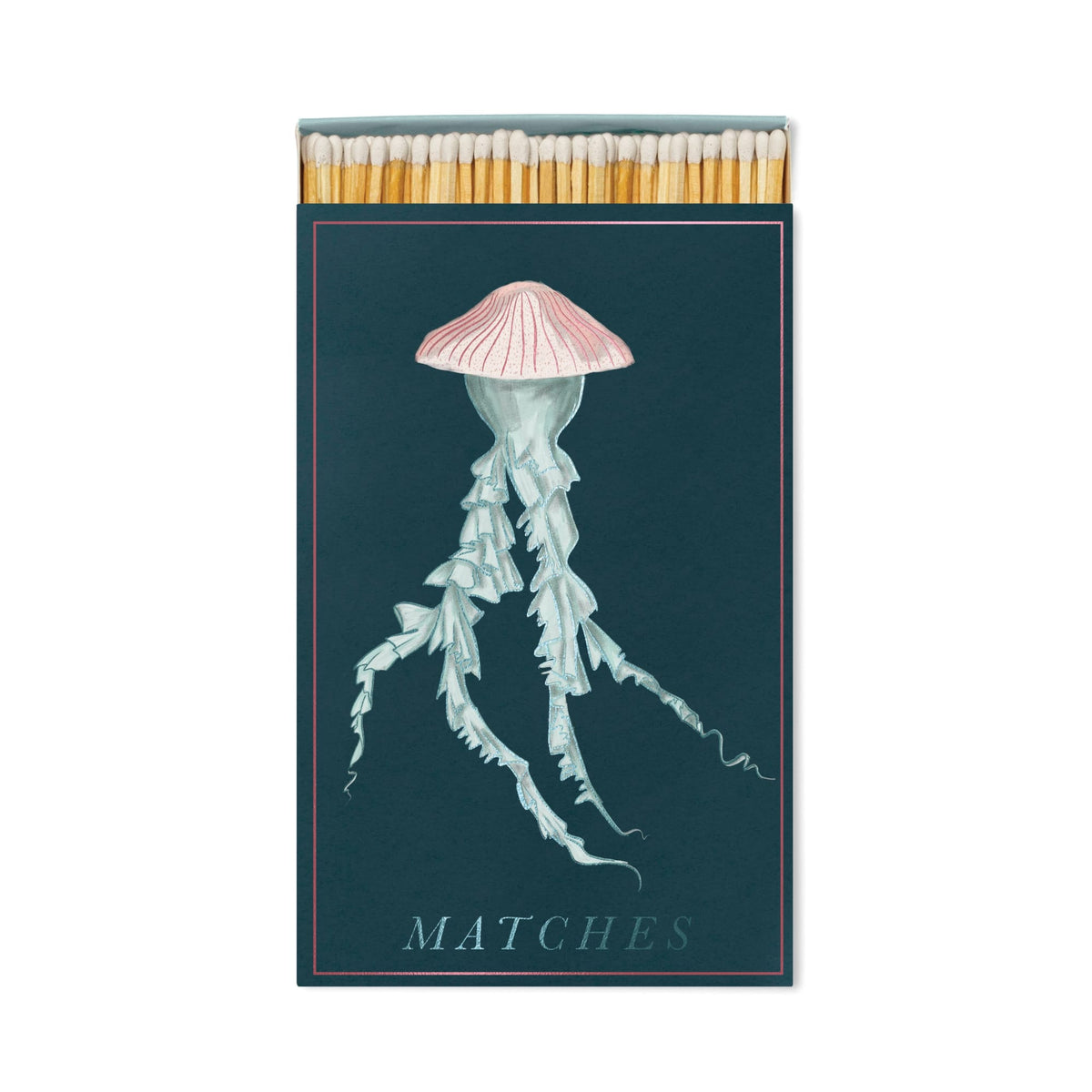 The Jellyfish - Large Rectangle Boxed Matches features a pink and white jellyfish on a dark background—perfect coastal décor or ocean lover gift. MATCHES is in light blue, with matchsticks peeking out at the top.