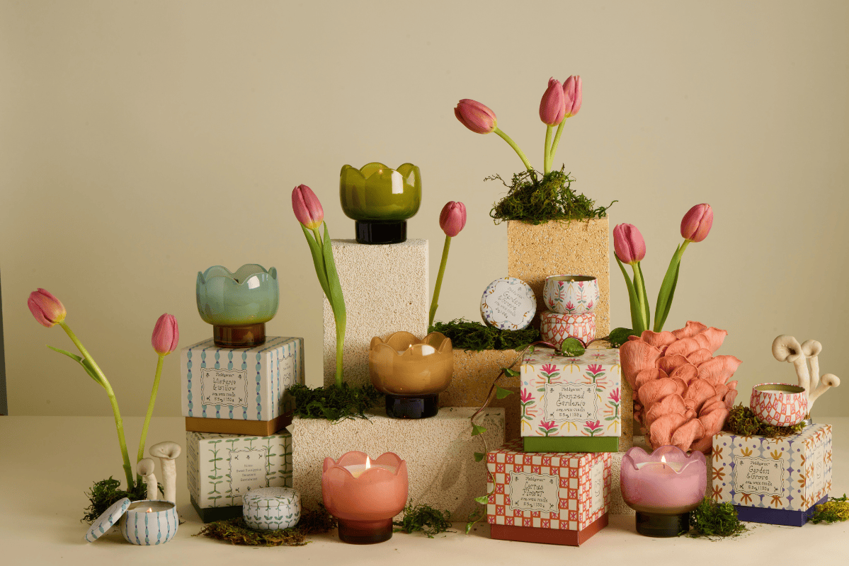 Decorative items including tulip-shaped candles and decorative boxes on a neutral background