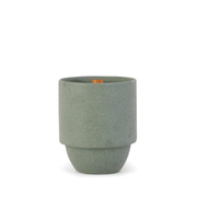 The Great Smoky Mountains - Parks 11 oz Candle features a green cylindrical ceramic vessel with a matte finish, tapered base, and small wooden tag on the rim, echoing national park vibes against a white background.