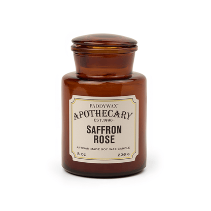 Brown candle jar labeled 'Saffron Rose' by Paddywax on a white background