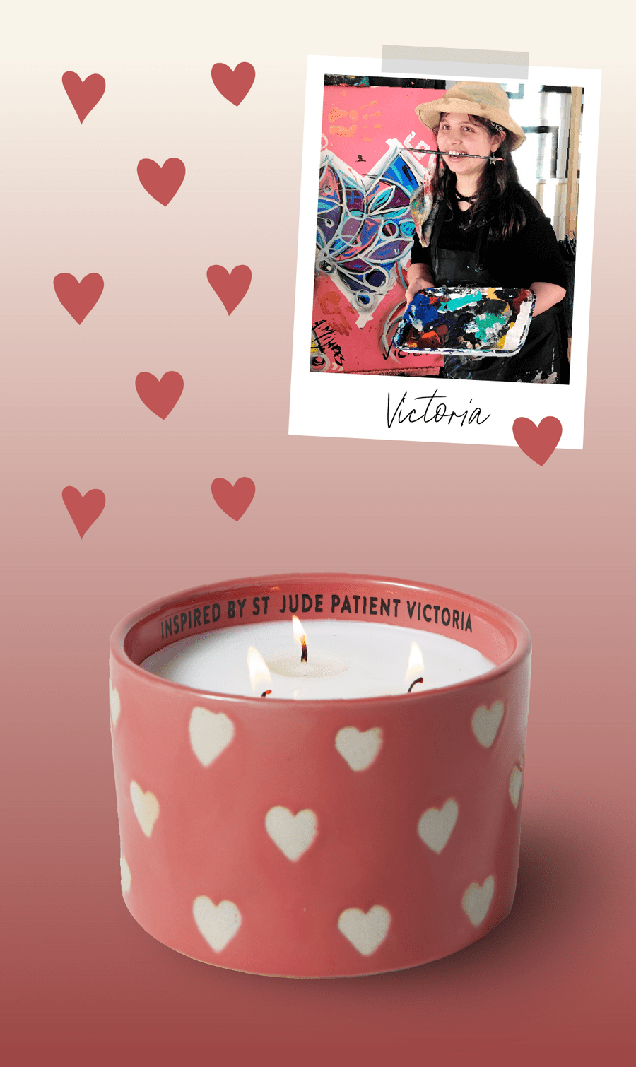A pink candle with white hearts and three wicks sits below a photo of a girl in a hat holding a paint palette. The rim of the candle reads, “Inspired by St. Jude patient Victoria.” Red hearts decorate the background.