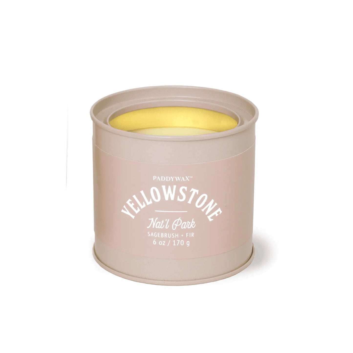 A beige 6 oz Paddywax Yellowstone - Parks Tin Candle labeled "Yellowstone Natl Park Sagebrush + Fir" with visible wax inside.