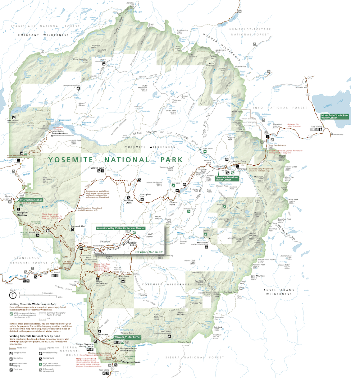 Map of Yosemite National Park showing main roads, entrances, visitor centers, campgrounds, trails, and points of interest, with surrounding forests and natural features labeled. North is at the top; scale and legend at bottom.