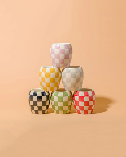 Checkmate candles stacked in a pyramid shape. 
