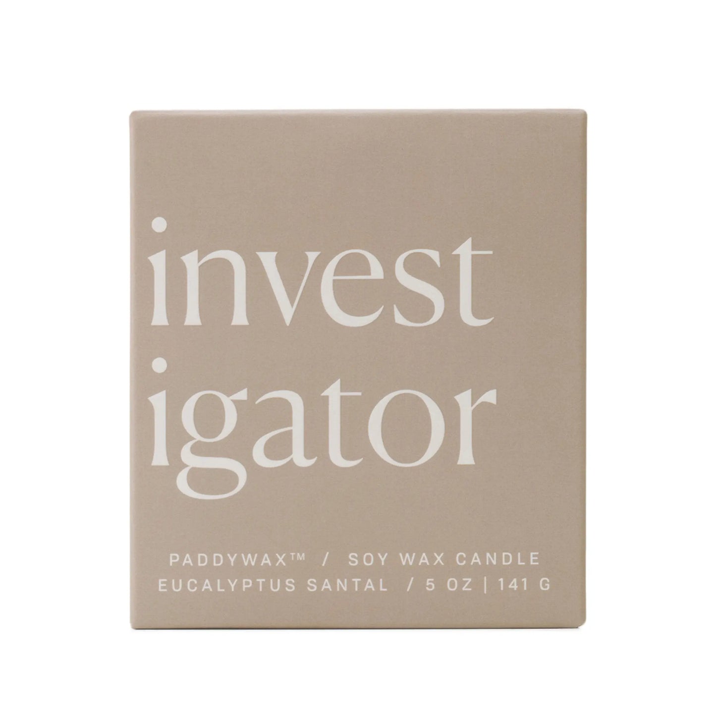 A beige ombre glass box displays "investigator" in bold white letters. Below: Enneagram #5 Investigator 5 oz Candle – Eucalyptus Santal, a Paddywax soy wax candle and thoughtful gift.