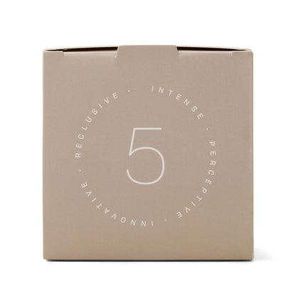 The Enneagram #5 Investigator 5 oz Candle - Eucalyptus Santal comes in a beige box featuring a centered number 5 with the words INTENSE, PERCEPTIVE, INNOVATIVE, and RECLUSIVE arranged in a circle around it.