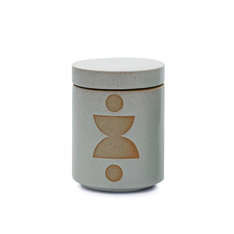 The Ocean Rose + Bay - Form 12 oz Candle comes in a ceramic jar with a lid, featuring a minimalist geometric pattern and natural speckled finish—ideal as a decorative accent or for adding fragrance to your home.