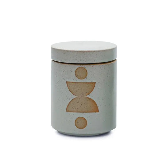 The Ocean Rose + Bay - Form 12 oz Candle comes in a ceramic jar with a lid, featuring a minimalist geometric pattern and natural speckled finish—ideal as a decorative accent or for adding fragrance to your home.