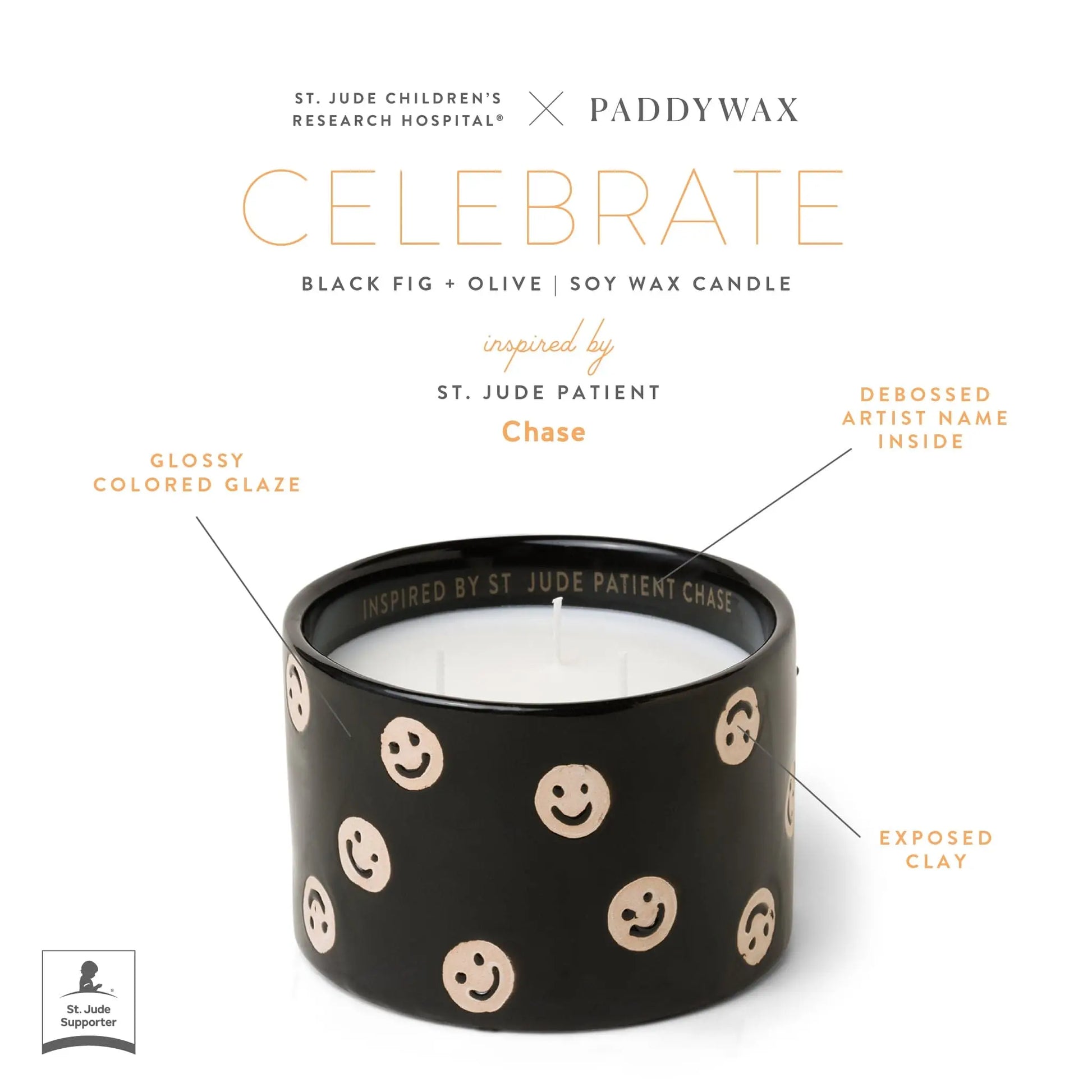 The Black Fig + Olive - St. Jude Giveback "Celebrate" 11 oz. Candle features black soy wax, tan smiley faces, a glossy glaze, exposed clay, and "Inspired by St. Jude Patient Chase" inside—a heartfelt Paddywax x St. Jude collaboration.