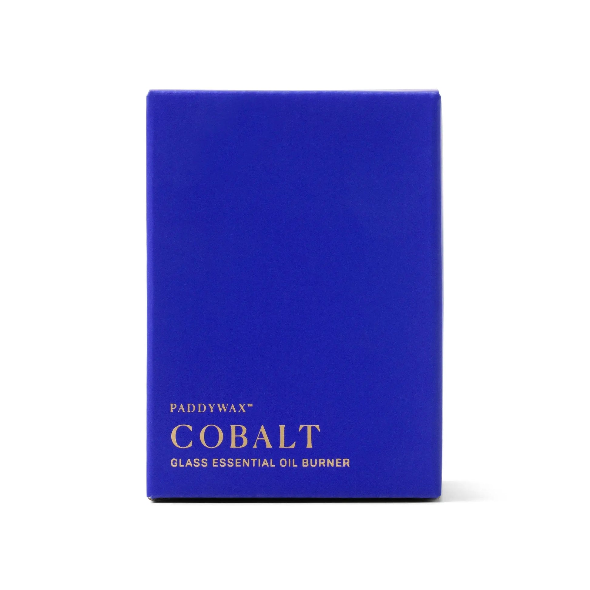 A cobalt blue rectangular box with gold text reads "Cobalt Blue Glass - Essential Oil Burner & Tea Light Candle" on the front, perfect for aromatherapy. The box stands upright against a white background.