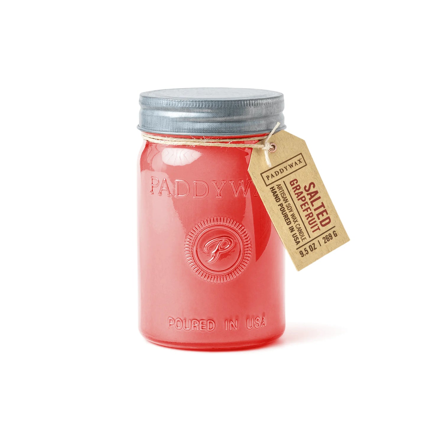 The Salted Grapefruit - Relish 9.5 oz Candle features pink wax in a jar with a metal lid and brown tag, making it stylish home décor and reusable as storage once finished. Labeled Paddywax for a fresh fragrance boost.